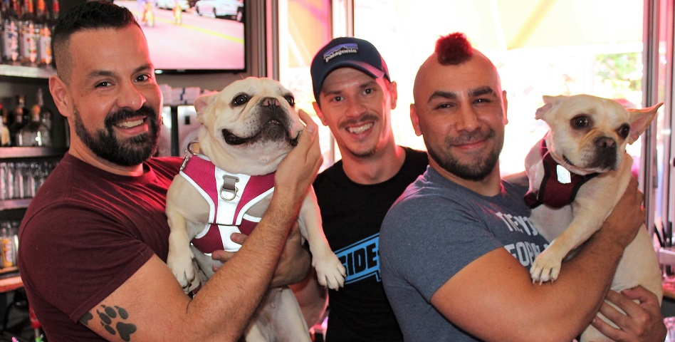 img src="Dog-Day-Saturday-Afternoon.jpg" alt="owners of Sidetrack Video Bar with their dogs"