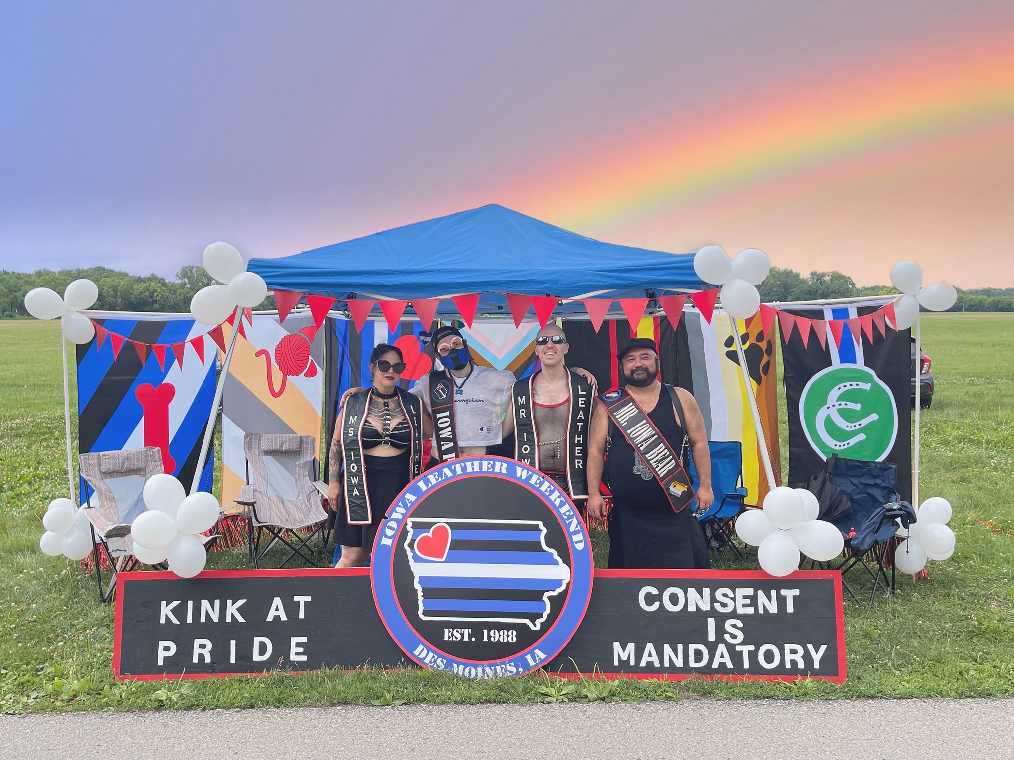 Bettie Rage, Deek Pheeps and other title holders at the Iowa Leather Weekend tent at Capital City Pride