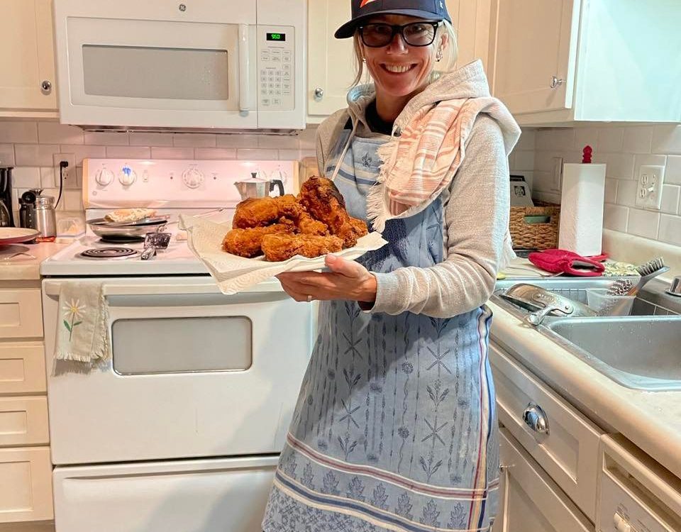 Nikki Lunden Trotter making chicken in her house