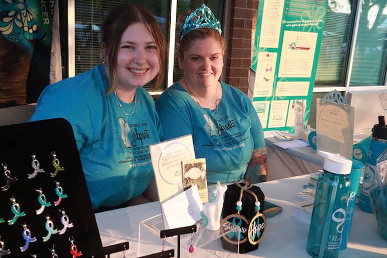 Lindsey Garrison and Abbie Griffin of NormaLeah Ovarian Cancer Institute at the Pride Party at Bass Street Landing in Moline June 17, 2023.