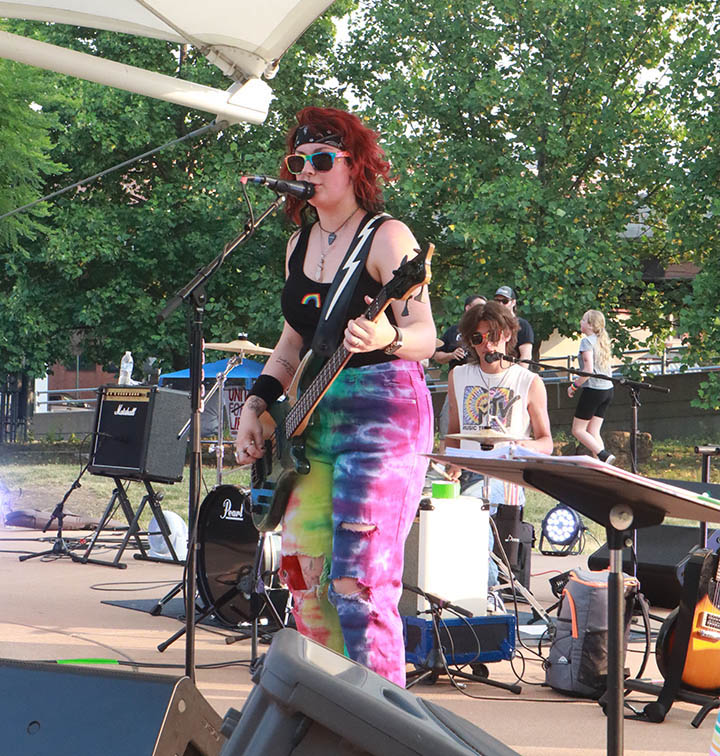 Izzy McChesney (front) and Carson Schar of BTDT (Been There Done That) at the Pride Party at Bass Street Landing in Moline June 17, 2023.