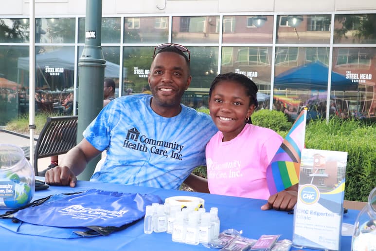 Shaun Taylor and daughter Maddi at the Community Health Care vendor booth at the Pride Party at Bass Street Landing June 17, 2023.