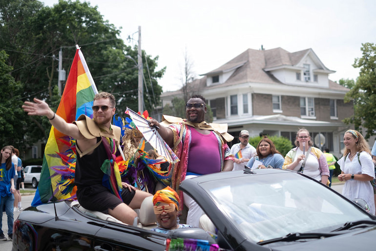 Mayor Bruce Teague (right) and husband Colton Alexander in the Iowa City Pride Parade June 15