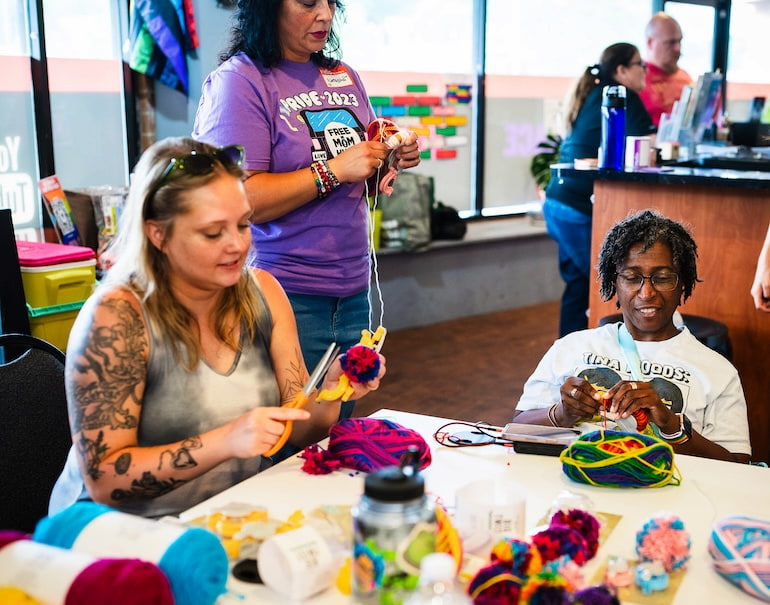 Adults during Craft Night at Clock Inc. LGBT+ Community Center in Rock Island with Free Mom Hugs