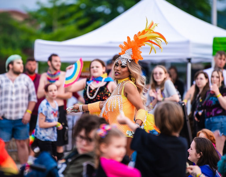 Miss Jaide dances through the crowd at the Quad Cities Pride Festival June 1.